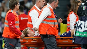 The Barcelona midfielder was taken off the Bernabéu pitch on a stretcher in the first half against Real Madrid.