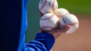 Feb 23, 2024; Phoenix, Arizona, USA; Detailed view of official MLB baseballs in the hand of a ballboy during the Los Angeles Dodgers spring training game against the San Diego Padres at Camelback Ranch-Glendale. Mandatory Credit: Mark J. Rebilas-USA TODAY Sports