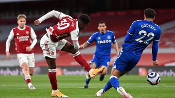 LONDON, ENGLAND - APRIL 23: Eddie Nketiah of Arsenal shoots whilst under pressure from Ben Godfrey of Everton during the Premier League match between Arsenal and Everton at Emirates Stadium on April 23, 2021 in London, England. Sporting stadiums around th