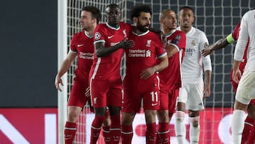 MADRID, SPAIN - APRIL 06: Mohamed Salah of Liverpool (C) celebrates with teammates Sadio Mane and Thiago Alcantara after scoring their team&#039;s first goal during the UEFA Champions League Quarter Final match between Real Madrid and Liverpool FC at Esta