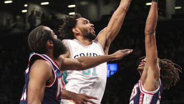 Jan 9, 2022; Brooklyn, New York, USA; San Antonio Spurs forward Keita Bates-Diop (31) moves past Brooklyn Nets forwards Kevin Durant (7) and Nic Claxton (33) for a basket in the first quarter at Barclays Center. Mandatory Credit: Wendell Cruz-USA TODAY Sports
