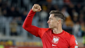 Poland's forward #09 Robert Lewandowski celebrates scoring the 0-2 goal during the 2026 World Cup qualifiers Europe zone group G football match between Lithuania and Poland on October 12, 2025 in Kaunas, Lithuania. (Photo by Petras Malukas / AFP)