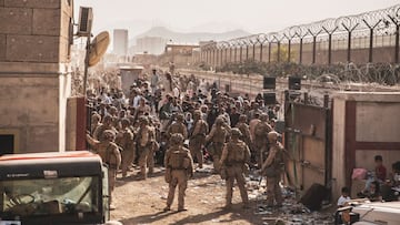 U.S. Marines provide assistance at an Evacuation Control Checkpoint (ECC) during an evacuation at Hamid Karzai International Airport, Afghanistan, August 22, 2021. Picture taken August 22, 2021.  U.S. Marine Corps/Staff Sgt. Victor Mancilla/Handout via RE