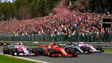 Vettel closes gap after Alonso crash in Belgium