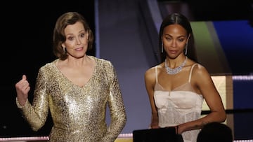 Zoe Saldana and Sigourney Weaver present an award during the Oscars show at the 95th Academy Awards in Hollywood, Los Angeles, California, U.S., March 12, 2023. REUTERS/Carlos Barria