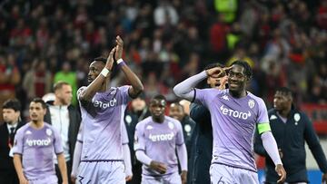 Monaco's French defender Axel Disasi (R) and Monaco's French defender Chrislain Matsima celebrate with teammates and fans at the end of the 3-2 goal during the UEFA Europa League, first-leg play-off football match Bayer 04 Leverkusen v AS Monaco in Leverkusen, western Germany, on February 16, 2023. (Photo by INA FASSBENDER / AFP)
