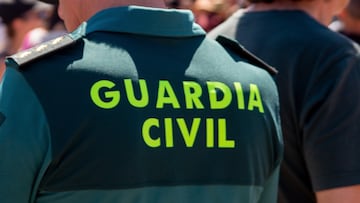Castilla y León, Spain; 08/06/2023: Military police agents known as "Civil Guard" in one day working in a concentration of people in a urban motorbike championship. They are dressed in green uniforms and caps.