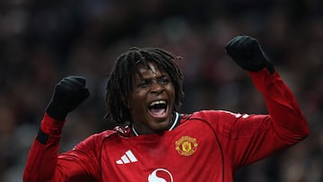 Manchester United's Danish defender #13 Patrick Dorgu celebrates after scoring the opening goal of the English Premier League football match between Manchester United and Newcastle United at Old Trafford in Manchester, north west England, on December 26, 2025. (Photo by Darren Staples / AFP) / RESTRICTED TO EDITORIAL USE. No use with unauthorized audio, video, data, fixture lists, club/league logos or 'live' services. Online in-match use limited to 120 images. An additional 40 images may be used in extra time. No video emulation. Social media in-match use limited to 120 images. An additional 40 images may be used in extra time. No use in betting publications, games or single club/league/player publications. /