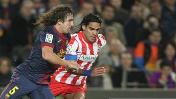 Carles Puyol of FC Barcelona vies for the ball with Falcao of Atletico Madrid during the Spanish league football match between FC Barcelona and Atletico Madrid at the Camp Nou stadium on December 16, 2012 in Barcelona, Spain. Photo: Manuel Blondeau/AOP.Press/Corbis (Photo by AOP.Press/Corbis via Getty Images)