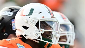 ORLANDO, FLORIDA - DECEMBER 28: Cam Ward #1 of the Miami Hurricanes runs back to the sideline after a touchdown in the first quarter against the Iowa State Cyclones during the 2024 Pop-Tarts Bowl at Camping World Stadium on December 28, 2024 in Orlando, Florida. Julio Aguilar/Getty Images/AFP (Photo by Julio Aguilar / GETTY IMAGES NORTH AMERICA / Getty Images via AFP)