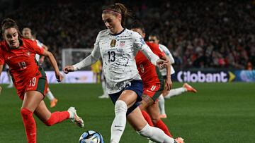 USA's forward #13 Alex Morgan runs with the ball during the Australia and New Zealand 2023 Women's World Cup Group E football match between Portugal and the United States at Eden Park in Auckland on August 1, 2023. (Photo by Saeed KHAN / AFP)