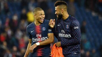 Paris Saint-Germain&#039;s French forward Kylian Mbappe (L) jokes with Paris Saint-Germain&#039;s Cameroonian forward Eric Choupo-Moting at the end of the French L1 football match between Paris Saint-Germain (PSG) and Amiens at the Parc des Princes stadiu