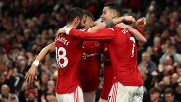 MANCHESTER, ENGLAND - MAY 02: Cristiano Ronaldo of Manchester United celebrates scoring their side's second goal with teammates, which is later disallowed for offside, during the Premier League match between Manchester United and Brentford at Old Tra
