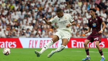 Real Madrid's French forward #09 Kylian Mbappe shoots during the Spanish league football match between Real Madrid CF and Real Valladolid FC at the Santiago Bernabeu stadium in Madrid on August 25, 2024. (Photo by Pierre-Philippe MARCOU / AFP)
