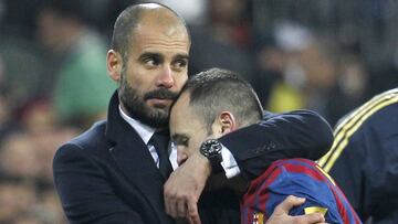 Guardiola e Iniesta.