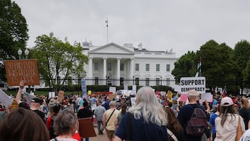 People take part in a protest against U.S. President Donald Trump, tariffs, deportations, a variety of other policies, and Elon Musk at the White House in one of many demonstrations taking place nationwide, in Washington, D.C., U.S., on April 19, 2025. REUTERS/Allison Bailey