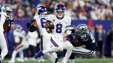 EAST RUTHERFORD, NEW JERSEY - SEPTEMBER 26: DeMarcus Lawrence #90 of the Dallas Cowboys sacks Daniel Jones #8 of the New York Giants during the second quarter in the game at MetLife Stadium on September 26, 2022 in East Rutherford, New Jersey. Elsa/Getty Images/AFP