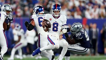 EAST RUTHERFORD, NEW JERSEY - SEPTEMBER 26: DeMarcus Lawrence #90 of the Dallas Cowboys sacks Daniel Jones #8 of the New York Giants during the second quarter in the game at MetLife Stadium on September 26, 2022 in East Rutherford, New Jersey.   Elsa/Getty Images/AFP