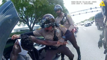 Tyreek Hill is forced from his vehicle by Miami-Dade Police Department officers.