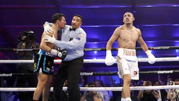 LAS VEGAS, NEVADA - AUGUST 13: Teofimo Lopez Jr. walks away as referee Tony Weeks stops his junior welterweight fight against Pedro Campa at Resorts World Las Vegas on August 13, 2022 in Las Vegas, Nevada. Lopez won the fight with a seventh-round TKO.   Steve Marcus/Getty Images/AFP
== FOR NEWSPAPERS, INTERNET, TELCOS & TELEVISION USE ONLY ==