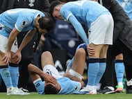 Manchester City's Spanish midfielder #16 Rodri (C-on ground) reacts after being injured during the English Premier League football match between Manchester City and Arsenal at the Etihad Stadium in Manchester, north west England, on April 19, 2026. (Photo by Darren Staples / AFP) / RESTRICTED TO EDITORIAL USE. No use with unauthorized audio, video, data, fixture lists, club/league logos or 'live' services. Online in-match use limited to 120 images. An additional 40 images may be used in extra time. No video emulation. Social media in-match use limited to 120 images. An additional 40 images may be used in extra time. No use in betting publications, games or single club/league/player publications. /