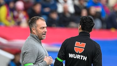 Barcelona's German coach Hans-Dieter Flick (L) gestures during the Spanish league football match between FC Barcelona and Deportivo Alaves at the Estadi Olimpic Lluis Companys in Barcelona on February 2, 2025. (Photo by Josep LAGO / AFP)