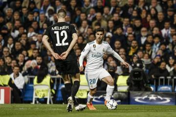 Marco Asensio runs at PSG defender Thomas Meunier after coming on in Wednesday's Champions League match.