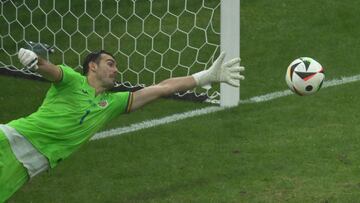 Romania's goalkeeper #01 Florin Nita dives for the ball  during the UEFA Euro 2024 Group E football match between Slovakia and Romania at the Frankfurt Arena in Frankfurt am Main on June 26, 2024. (Photo by Kirill KUDRYAVTSEV / AFP)