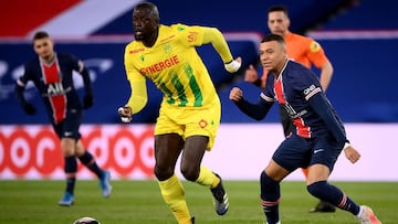 14 March 2021, France, Paris: Nantes' Abdoulaye Toure (L) in action against PSG's Kylian Mbappe during the French Ligue 1 soccer match between Paris Saint-Germain and FC Nantes at Le Parc des Princes stadium. Photo: Franck Fife/AFP/dpa
14/03/20