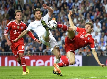 Things change | Ex-Real Madrid's midfielder Xabi Alonso vies with Bayern Munich's midfielder Mario Goetze in the 2014 Champions League semifinal.