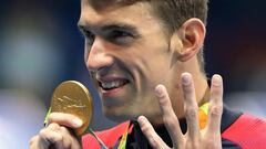 FILE - In this Aug. 11, 2016 file photo, United States&#039; Michael Phelps celebrates winning the gold medal in the men&#039;s 200-meter individual medley during the swimming competitions at the 2016 Summer Olympics,  in Rio de Janeiro, Brazil. (AP Photo/Lee Jin-man, File)