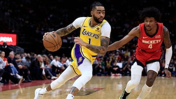 HOUSTON, TEXAS - JANUARY 29: D'Angelo Russell #1 of the Los Angeles Lakers drives around Jalen Green #4 of the Houston Rockets during the first half at Toyota Center on January 29, 2024 in Houston, Texas. NOTE TO USER: User expressly acknowledges and agrees that, by downloading and or using this photograph, User is consenting to the terms and conditions of the Getty Images License Agreement.�   Carmen Mandato/Getty Images/AFP (Photo by Carmen Mandato / GETTY IMAGES NORTH AMERICA / Getty Images via AFP)