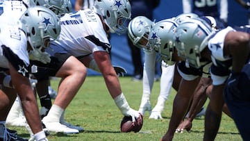 Jul 22, 2025; Oxnard, CA, USA; A general overall view as Dallas Cowboys center Brock Hoffman snaps the ball at the line of scrimmage during training camp at the River Ridge Fields. Mandatory Credit: Kirby Lee-Imagn Images