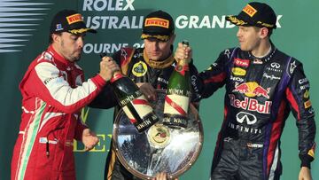 (From L-R) Ferrari Formula One driver Fernando Alonso of Spain, Lotus Formula One driver Kimi Raikkonen of Finland and Red Bull Formula One driver Sebastian Vettel of Germany celebrate after the Australian F1 Grand Prix at the Albert Park circuit in Melbo