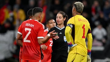 MAINZ, GERMANY - MARCH 25: Referee Maria Ferrieri Caputi speaks to Luis Abram and Pedro Gallese of Peru during the international friendly match between Germany and Peru at MEWA Arena on March 25, 2023 in Mainz, Germany. (Photo by Will Palmer/Sportsphoto/Allstar via Getty Images)