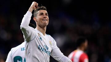 TOPSHOT - Real Madrid's Portuguese forward Cristiano Ronaldo celebrates his fourth goal during the Spanish League football match between Real Madrid CF and Girona FC at the Santiago Bernabeu stadium in Madrid on March 18, 2018. / AFP PHOTO / JAVIER S