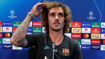 Griezmann says he doesn't speak much to Messi
