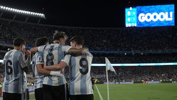 Argentina's midfielder #17 Giuliano Simeone celebrates with his teammates Argentina's defender #16 Nahuel Molina, Argentina's midfielder #08 Enzo Fernandez and Argentina's forward #09 Julian Alvarez after scoring his team's fourth goal during the 2026 FIFA World Cup South American qualifiers football match between Argentina and Brazil at the Mas Monumental stadium in Buenos Aires province, on March 25, 2025. (Photo by JUAN MABROMATA / AFP)