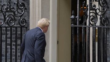 Prime Minister Boris Johnson walks into 10 Downing Street, London, after reading a statement formally resigning as Conservative Party leader after ministers and MPs made clear his position was untenable. He will remain as Prime Minister until a successor is in place. Picture date: Thursday July 7, 2022. (Photo by Gareth Fuller/PA Images via Getty Images)