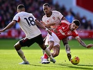 Liverpool's Dutch striker #18 Cody Gakpo (L) and Liverpool's Dutch midfielder #38 Ryan Gravenberch (behind) challenge Nottingham Forest's English midfielder #10 Morgan Gibbs-White (R) during the English Premier League football match between Nottingham Forest and Liverpool at The City Ground in Nottingham, central England on February 22, 2026. (Photo by Ben STANSALL / AFP) / RESTRICTED TO EDITORIAL USE. No use with unauthorized audio, video, data, fixture lists, club/league logos or 'live' services. Online in-match use limited to 120 images. An additional 40 images may be used in extra time. No video emulation. Social media in-match use limited to 120 images. An additional 40 images may be used in extra time. No use in betting publications, games or single club/league/player publications. /