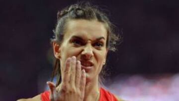 Russia's Elena Isinbaeva gestures as she competes in the women's pole vault final at the athletics event of the London 2012 Olympic Games on August 6, 2012 in London. AFP PHOTO / JOHANNES EISELE