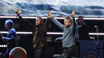 TORONTO, ONTARIO - AUGUST 24: (EDITORIAL USE ONLY, NO COMMERCIAL USE, NO SPECIAL INTEREST OR SINGLE ARTIST PUBLICATION USE) Liam Gallagher and Noel Gallagher perform onstage at the Oasis Live '25 - Toronto concert at Rogers Stadium on August 24, 2025 in Toronto, Ontario. (Photo by Kevin Mazur/Getty Images)