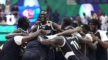 South Sudan players celebrate after winning the match against Angola.