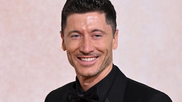 (FILES) In this file photo taken on May 26, 2022 Polish forward Robert Lewandowski arrives to attend the annual amfAR Cinema Against AIDS Cannes Gala at the Hotel du Cap-Eden-Roc in Cap d'Antibes, southern , on the sidelines of the 75th Cannes Film Festival. - Robert Lewandowski is ing Barcelona in a 50 million euro deal until 2027, the Spanish club said on July 19, 2022. Barca released a statement confirming the move three days after both clubs announced that a deal "in principle" had been struck for the Polish striker to move to La Liga. (Photo by Stefano Rellandini / AFP)