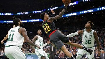 Dec 14, 2018; Boston, MA, USA; Atlanta Hawks forward John Collins (20) throws up a shot between Boston Celtics guard Kyrie Irving (11) and guard Marcus Smart (36) during the second quarter at TD Garden. Mandatory Credit: Winslow Townson-USA TODAY Sports