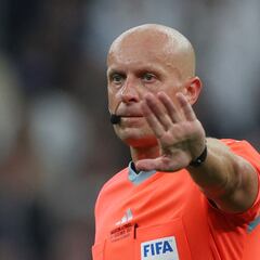 Who is Szymon Marciniak, the referee for Borussia Dortmund vs AC Milan in the Champions League?