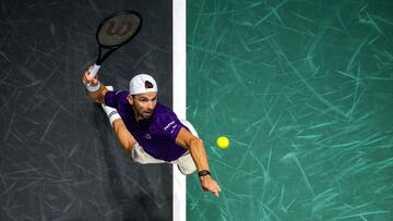 Bulgaria's Grigor Dimitrov serves to France's Giovanni Mpetshi Perricard during their men's singles match on day one of the Paris ATP Masters 1000 tennis tournament at the Paris La D�fense Arena in Nanterre, on the outskirts of Paris, on October 27, 2025. (Photo by Fran�ois-Xavier MARIT / AFP)