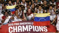 Venezuela&#039;s head coach Nestor Garcia (C) and players celebrate with their trophy after defeating Argentina in their 2015 FIBA Americas Championship final basketball game, at the Sports Palace in Mexico City September 12, 2015. REUTERS/Henry Romero      TPX IMAGES OF THE DAY     