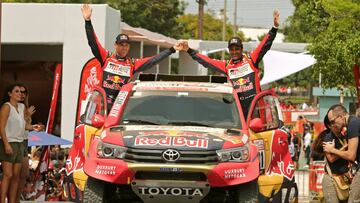 Dakar Rally - 2018 Peru-Bolivia-Argentina Dakar rally - 40th Dakar Edition - January 6, 2018 -  Toyota Gazoo Racing SA team driver Nasser Al-Attiyah of Qatar (R) and co-driver Matthieu Baumel of France wave on the podium during the departure ceremony in L