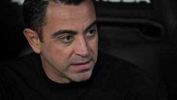 Barcelona's Spanish coach Xavi looks on before the start of the Spanish league football match between Valencia CF and FC Barcelona at the Mestalla stadium in Valencia on October 29, 2022. (Photo by JOSE JORDAN / AFP)
